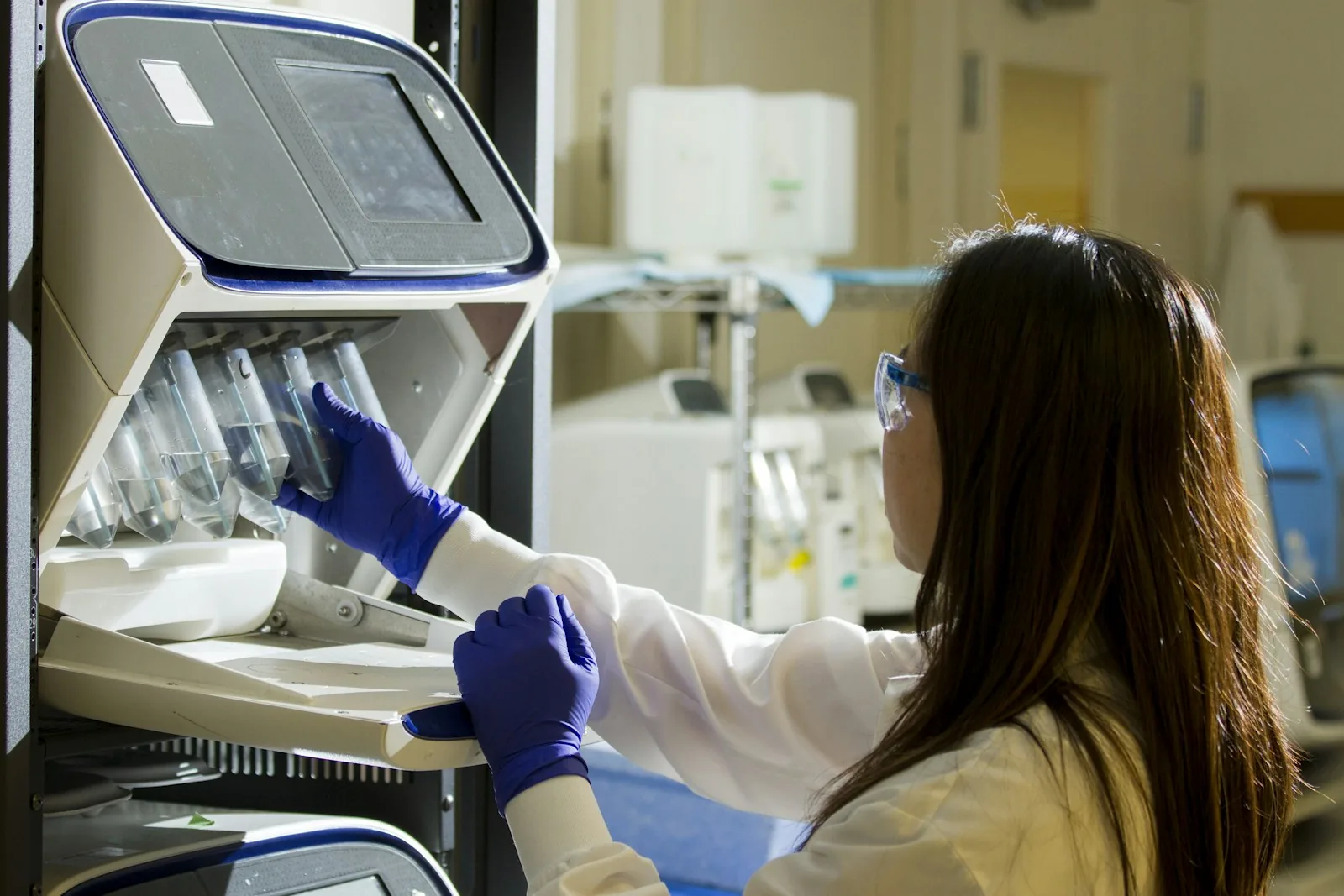 Laboratory technician preparing samples under controlled clinical conditions