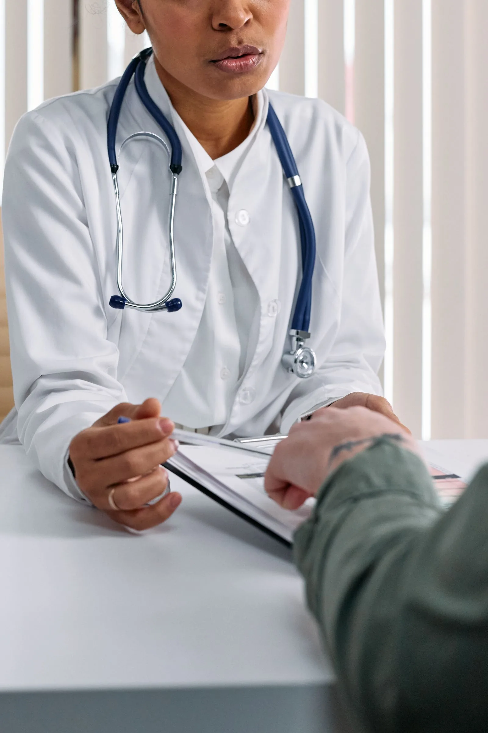 Clinician reviewing a treatment plan with a patient